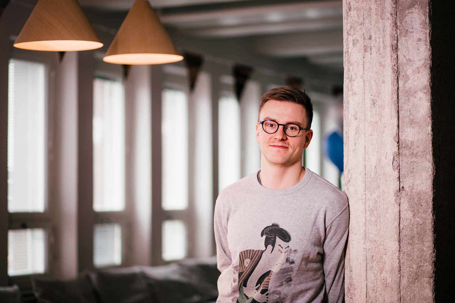 Joonas, the CEO of Fraktio,  leaning against the wall in the office